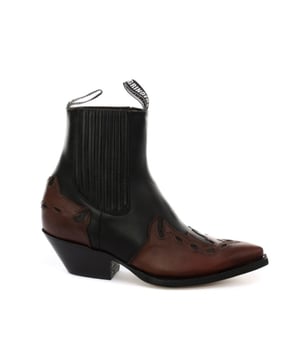 This boot is a shorter version of the Grinders ‘Arizona’ cowboy style and has been reimagined in a classic Cuban heeled Chelsea boot. The upper is made of high-quality leather and a stylish leather overlay appears on the pointed toe with a convenient elasticated gusset and pull loops implemented at the boot opening. The interior is crafted from soft leather which cushions the foot and allows for breathability. The underside of the shoe displays a stacked 1.5” heel which is built onto a durable welted leather sole that has been engraved with the iconic Grinders Bulldog logo. • Goodyear Welted • Leather upper • Soft Leather lining • Stacked leather heels • Leather Soles • Made in Mexico