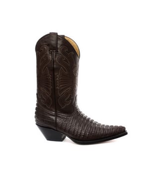 De Grinders Carolina is een hoogwaardige, slijtvaste leren western cowboylaars. Deze stijl heeft een bovenwerk van donkerbruin, geolied, slijtvast leer met een contrastrijk gedetailleerd patroon dat op de schacht is gestikt en een krokodillenstaartontwerp in reliëf op de wreef. Deze laars heeft een iconische westernstijl gekregen met introducties als een spitse neus en een 2-inch Cubaanse hak en is comfortabel gemaakt met behulp van een volledig lederen voering en binnenzool. De echt leren zool met merklogo zorgt voor meer duurzaamheid en de twee aantreklussen aan de zijkant maken het gemakkelijker om de laarzen aan te trekken, wat allemaal bijdraagt ​​aan het comfort en de functionaliteit van deze stijlvolle, luxe Carolina-laars. • Goodyear welted zool • Leren bovenwerk • Luxe lederen voering aan de binnenkant • Gestapelde leren hakken van 5 cm • Leren zolen • Gemaakt in Mexico