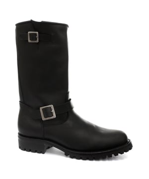 The Grinders Wild One are crafted from smooth black leather to create a clean sophisticated biker boot. Straps are located at the foot and top line and are secured via a mirror-finished Grinder buckle to adjust the fit of the boot. The heel of this boot also is panelled off and is heat embossed with the iconic Grinders Bulldog logo and the underside of the boot features a chunky, oil-resistant sole unit which makes this boot durable and imbues it with a long-lasting quality. • High Leg Engineer Boots • Goodyear Welted • Chunky Commando Sole • Features a premium black leather upper