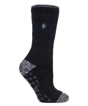 Keep feet warm, protected and supported around the home in a pair of Heat Holders slipper socks. They have the normal extra warm feeling of Heat Holders original thermal socks, but they also feature special anti slip grips on their soles, which will prevent slipping on wooden or laminate flooring to keep you secure around your home. With a massive tog rating of 2.34 they are the warmest thermal sock for you - 7X warmer than the ordinary cotton sock (0.33 tog)! These seriously chunky and warm slipper socks are made with a specifically developed extra heavy bulk yarn with extreme thermal qualities and moisture wicking abilities. Their long looped thermal pile created with innovative knitting technology produces the unique extra long looped cushion pile to hold in more warm air - increasing the thermal tog rating even more. They also have a super-soft brushed inner which maximises the amount of warm air held to the skin for all-day warmth and comfort. These socks are made from 91% Acrylic, 5% Nylon, 3% Polyester, 1% Elastane, are available in Ladies 4-8 UK and come in three Heel & Toe styles which include Black, Pink & Purple. They are safely machine washable.