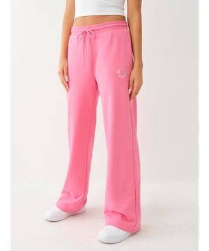 The Crystal French Terry Sweat Pant is cute and comfortable. This pair of sweats features a drawstring high-rise waist, wide leg, and front horseshoe crafted from rhinestones.
