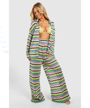 Heading to the beach this summer? Make a splash this season thanks to our latest collection of beachwear, perfect for all your vacations, staycations and baecations. Cause a storm in crochet beach trousers and a crop top, or keep it casual in a beach playsuit and sliders. Feeling classy? Turn some serious heads in a beach maxi dress, dainty jewellery, and woven sandals. Whatever your vibe, our women's beachwear edit has you covered, girl. Pass the 2-4-1 cocktail menu, we'll take one of everything!Style: Beach TrousersDesign: GeoFabric: Knitted