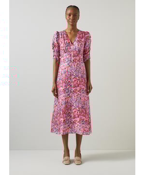 Imagine walking through a blooming garden at twilight in the Erin watercolour floral jacquard dress. This pink, woven masterpiece features a delicate v-neck, full length sleeves, and a back zip, crafted from a luxurious viscose mix with a jacquard print base. Perfectly complemented with strappy sandals or elegant heels for any evening occasion.