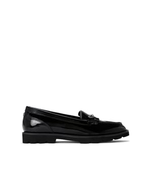 The Carvela Crown loafer is crafted from a black patent leather alternative with subtle texture. There is a gunmetal horse bit chain on the vamp and gunmetal Icon C stud at the back of the ankle. This product features All Day Long technology.
