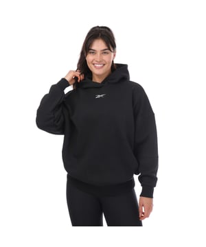 Womens Reebok Lux Oversized Hoody in black.- Double lined hood with overlap.- Round sleeves.- Ribbed cuffs and hem.- Oversized fit.- 57% Cotton  30% Polyester (Recycled)  13% Cotton (Recycled). - Ref: H51828