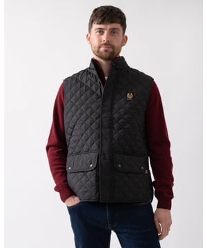 The Icon Gilet in gunmetal. A diamond-quilted padded vest that can be snapped into the Trialmaster and Fieldmaster jackets to add a warming mid-layer.

Quilted recycled nylon
Snaps into the Trialmaster, Trialmaster Panther Jacket and Fieldmaster Jacket
Soft corduroy collar
Belstaff phoenix patch
Press-stud collar fastening
Snap-fastening waist adjustors
Two large lower press-stud pockets
Recycled polyester

Shell: 100% polyester, Lining: 100% polyester, Filling: 100% polyester
105295