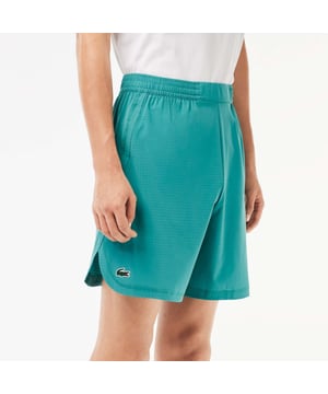 Men’s Lacoste Sport Check Stretch Mesh Shorts Relaxed  loose cut: Comfortable and fluid. Wide waistband with drawstring closure: Great for all body types. Zipped side pockets: Keep your essentials safe. Green silicone crocodile: The hallmark of excellence. Stretch taffeta and mesh: Breathable fabric for optimal ventilation.