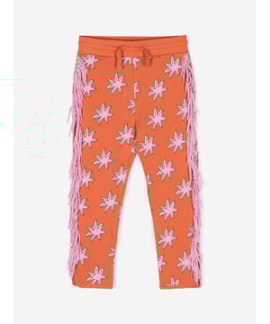 revitalise your girl's fashion lineup with the vibrant Girls Fringed Joggers in Orange by Stella_McCartney, a delightful standout for AW2024. Impeccably crafted, these joggers fuse luxury and whimsy in a rich shade that captures the essence of autumn brilliance. Key features include: **Bold Orange Hue**: Captures the vibrant spirit of the season. **Dynamic Fringes**: Add a playful flair to every movement. **Premium Comfort**: Expertly crafted for warmth and softness. **Designer Craftsmanship**: Trust in the renowned Stella_McCartney quality.Elevate her style with a touch of designer flair‚perfect for those brisk fall adventures!