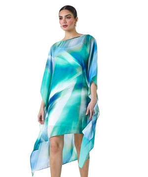Abstract Print Chiffon Draped Tunic Dress from Roman. Add a touch of elegance to your wardrobe with this Ariella chiffon draped tunic dress. The round neckline and abstract print are complemented by the floaty chiffon draping, creating a flattering dipped hem and cape-style sleeves for a chic look. The stretch jersey inner slip dress lining ensures all-day comfort, while the knee length and adjustable straps in the lining add extra versatility to this piece. Perfect for those Summer wedding invitations, pair with strappy heels and a clutch bag for your next special occasion!