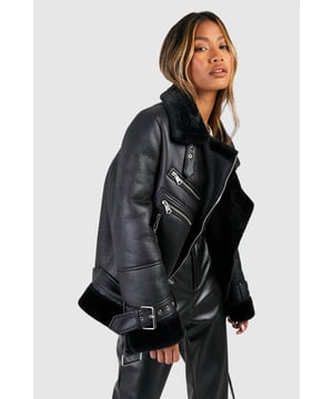 Take your outfit to new style heights with an aviator jacket. Perfect for layering, create a stylish oversized silhouette as you choose from crop belted jackets to faux fur lined options. A cross between a classic flight jacket and a leather biker, it's all about the detailing with this snug winter staple. Pair your aviator coat with high waisted mom jeans and a fierce attitude as you stroll your way through your social calendar.Style: Aviator JacketFabric: Faux LeatherLength: LonglineSleeve Length: Long Sleeve