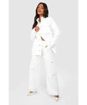 Wide-leg design for a relaxed, on-trend silhouette
        Cargo-style pockets add a utilitarian edge
        High-waisted fit for a flattering shape
        Zip-detail pocket for secure storage and added style
        Versatile denim fabric suitable for various casual occasions
    
    Make a bold statement with these eye-catching denim cargo trousers. The wide-leg cut offers a contemporary twist on classic jeans, whilst the high-waisted design accentuates your curves. The standout feature is the zip-detail pocket, adding both practicality and an edgy aesthetic. Perfect for the fashion-forward woman who values both style and functionality, these trousers can be dressed up or down with ease. For a chic daytime look, pair with a cropped jacket and sleek trainers, as seen on our model. Alternatively, style with a fitted bodysuit and heeled mules for an evening out with friends. The denim fabric ensures comfort and durability, making these trousers a versatile addition to your wardrobe for family gatherings, casual outings, or relaxed weekends about town.