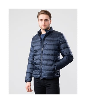 Designed for layering, the Light Down Jacket will be your go-to jacket when the temperature begins to drop. With a narrow, flattering fit and a high percentage of down (90% down, 10% feathers), this jacket is super lightweight, making it easy for traveling and layering. Wear alone in brisk weather, or under a wool jacket for additional insulation during the colder months for when the temperature drops to -10 degrees Celsius.

Regular fit
Two zip pockets at front
Two-way zipper
Printed GANT logo at front

Shell - Polyester 100%, Back Lining - Polyester 100%, Sleeve Lining - Polyester 100%, Padding - Down 90%, Feathers 10%