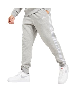 Keep your off-duty style fresh with these men's Aries Joggers from Nike. In a Grey colourway, these track-inspired sweats are cut from midweight fabric for a plush feel against the skin. They feature an adjustable drawcord at the waistband and cuffed ankles to taper the legs. With open-hand pockets and taped Nike branding to the sides, these pants are finished off with a Nike Futura badge to the left leg