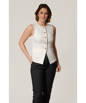 Discover the perfect blend of style and functionality with this tailored waistcoat. Featuring a flattering round neck, button front, and tailored fit, this waistcoat is designed to accentuate your curves and discreet front pockets. 