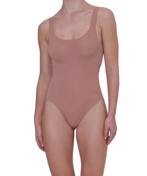 Sloggi ZERO Feel 2.0 Body. Seamless and soft stretch fabric. Smooth shapewear with light compression, scoop neck, removable cup padding and closure with poppers. Product is made of 76% GRS-certified recycled Polyamide and 24% Elastane and is machine washable.
