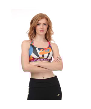 Women's adidas x FARM Rio Medium Support Sports Bra in Blue & Red.- Slim fit, medium support.- Scoop neck.- Mesh insert on the back.- Racer back.- AEROREADY.- 89% polyester(recycled), 11% polyester. Ref: HS1187.