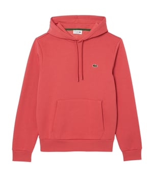 Der Lacoste Herren-Kapuzenpullover mit Tunnelzug, Rippbündchen und elastischem Bund bietet zeitlose Eleganz und hohen Tragekomfort. Mit der charakteristischen Krokodil-Applikation, einer praktischen Kängurutasche und dem bequemen Classic Fit ist dieser unifarbene Kapuzenpullover ein lässiges Essential für jeden Tag.