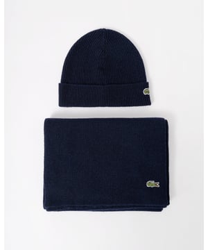 Lacoste knitwear is the result of 90 years of expertise. This scarf and beanie set is a great example. The ribbed knit creates a warm, soft feel with a timeless style.Essential pieces for modern life.

Recycled wool blend, limiting the need for raw materials
Scarf size: L71 x W12” / L180 x W30cm
Branded box
Crocodile on lower left of scarf
Crocodile on lower right of beanie
Wool (68%), Polyamide (26%), Acr (3%), Cotton (1%), Polyester (1%), Rayon (1%)

 