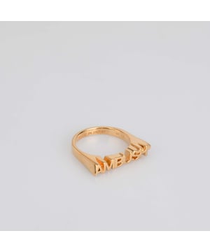 Ambush Nameplate Ring in Gold.- Large logo lettering.- 100% Brass. Ref: BWOC0220017600.