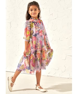 Beautiful oversize blooms printed on a dreamy diaphanous mesh fabric with soft tiers and ruffle sleeve detail. Dress up or dress down but always look picture perfect.. About Me: 100% Polyester. Look After Me: Think Planet. Wash At 30C.