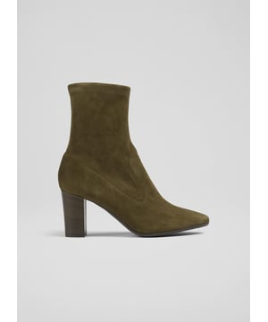 Sleek and elegant, our Alice stretch suede boots are an essential style for any autumn wardrobe. Crafted in Italy from super-soft olive green stretch suede, they have almond-shaped toes, a pull-on sock-like shape and stacked, 75mm block heels. The perfect everyday boots, wear them under tailored looks or with dresses when autumn arrives.