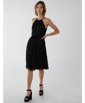 A pretty print pleated dress for you to wear on special occasions. This dress has a mesh top layer, a waist belt to accentuate your figure, and a halter neckline that will make you look even more elegant.