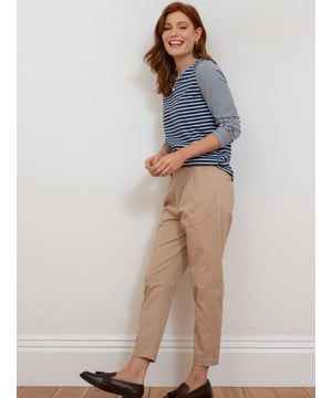 98% organic cotton 2% elastane | Beige | Twill fabric with a little bit of stretch | Apple enzyme washed for a soft hand feel | Zip and coconut button opening | Functional belt loops | Side pockets and back welt pockets | Cropped slim leg | Front pleating detail for a flattering fit | Made in Turkey | Machine washable at 40 degrees, or at 30 degrees to be kinder to the planet