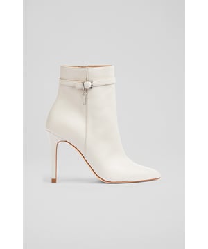 Featuring the LKB key logo detail, the new Clover ankle boots in our autumn collection, are sure to become signature classics. Beautifully made in Spain from super-soft cream nappa leather, they have a pointed toe, an ankle strap finished with a buckle and an LKB key charm, an inside zip and a leather-wrapped 100mm stiletto heel. Definitely designed for a good time, take them to dinner, or dancing.