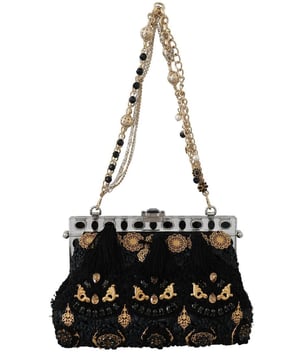 A estrenar con etiquetas.
  Borla negra con diseno de cristal barroco dorado.
  Bolso de mano al hombro.
  Material: 5% AC 8% Algodon 2% PL 70% Viscosa 5% WV 10% Piel de cocodrilo.
  Color: Negro con detalles de metal dorado.
  Color del cristal: Negro.