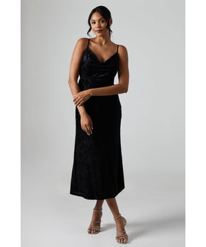 Elegant cowl neckline for a sophisticated drape
        Flattering midi length with a sleek silhouette
        Delicate spaghetti straps for a graceful look
        Textured devore fabric adds depth and interest
        Figure-hugging scuba crepe material for a smooth fit
    
    Make a lasting impression at your next formal event with this stunning Debut London By Coast Devore Cowl Neck Midi Dress. The alluring cowl neckline gracefully drapes to create a captivating focal point, while the midi length ensures a timeless and versatile appeal. Perfect for weddings, races, or graduations, this dress exudes elegance and sophistication. Style it with strappy metallic heels and a clutch bag for a polished ensemble. For cooler evenings, layer with a tailored blazer or a delicate wrap. The textured devore fabric adds a touch of luxury, making this dress a standout choice for any special occasion. Accessorise with statement earrings to complement the dress's refined simplicity and create a truly memorable look.