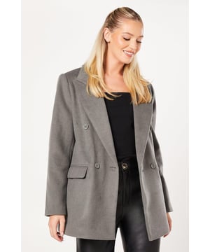 Brushed wool-blend fabric for a soft, luxurious feel
        Oversized fit with a double-breasted front closure
        Notched lapels and long sleeves for a classic silhouette
        Front flap pockets for practicality and style
        Versatile length, perfect for layering over various outfits
    
    This Dorothy Perkins brushed wool blazer coat is the epitome of sophisticated style. Its oversized fit offers a contemporary twist on the classic blazer, making it an ideal choice for the fashion-forward woman in her 30s. The double-breasted front and notched lapels create a polished look, perfect for smart casual events or when you want to add a touch of refinement to your ensemble. Style it over a turtleneck and tailored trousers for a chic brunch outfit, or wear it atop a midi dress for baby showers and other social gatherings. The versatile length allows for easy pairing with both trousers and dresses, while the front flap pockets add functionality without compromising on style. This coat effortlessly bridges the gap between casual and formal, making it a must-have piece for the modern woman who values both comfort and elegance in her wardrobe.