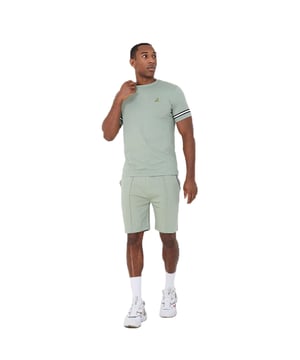 Get ready to embrace endless comfort and style this season with this t-shirt and shorts set from Brave Soul. Crafted from 100% cotton, the crew neck t-shirt features tape detail on the sleeves and embroidery detail on the chest. The matching shorts are made from a soft cotton blend and feature pintuck detail and two waist pockets. This set is the ultimate addition to your casual wardrobe. Model wears UK size M.