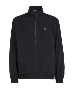 GBDeze jas voor heren van Tommy Jeans is gemaakt van gerecycled polyamide (duurzaam). Dit model heeft een opstaande kraag, lange mouwen en een ritssluiting.details van deze jas:2 steekzakken