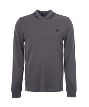 Inspired by the iconic Twin Tipped Shirt  Fred Perry presents the M3636 Twin Tipped Long Sleeve Polo Shirt. Crafted from BCI cotton pique in a regular fit for day-long comfort and breathability. Featuring a rib-knit collar  a two-button placket  long sleeves with ribbed cuffs and the signature twin-tipped detailing at the collar. Finished with the iconic Fred Perry Laurel wreath embroidered on the chest.BCI - By buying BCI cotton products  you're supporting more responsibly grown cotton through the Better Cotton Initiative.-Regular Fit-Pure Cotton Pique-Twin Tipped Detailing-Rib-knit Collar with Two Button Placket -Long Sleeves with Rib-Knit Cuffs-Recycled Tipping &amp; Sewing Threads-Buttons Made from Recycled Materials-Responsibly-Sourced Laurel Wreath Embroidery-Fred Perry Branding