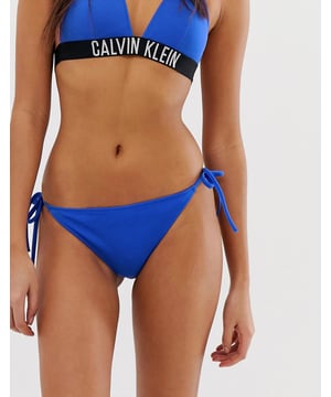 Product Details:
    Bikini briefs only
    Calvin Klein branding
    Tie sides
    Metal-bar detail
    High-cut leg

Materials:
    Main: 59% Polyamide, 41% Elastane