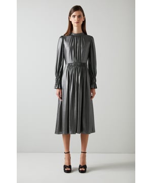 An LKB favourite in a fabric that looks and moves like liquid metal, the Louise dress is great on the dancefloor. Beautifully crafted from gunmetal matte lamÃ©, it has a round neck with pleat detail, long sleeves with fluted double elasticated cuffs, a gathered waist and a floaty midi skirt. Wear it with platform heels, a clutch and show her a good time.