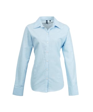 Ladies signature Oxford long sleeve Easycare blouse with wrinkle free finish for a smart and professional appearance. Soft collar styling. Rounded bottom hem. Fitted styling with bust and back darts. Pearlised buttons on light blue and white shirt, self c. Fabric:70% Cotton, 30% Polyester, cotton rich Oxford weave Weight: 135gsm. 8, 10, 12, 14, 16, 18, 20, 22, 24