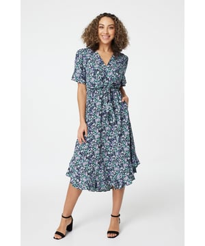 Every warm weather wardrobe needs a go-to floral tea dress like this one. It has a V-neck, a self tie knot front detail, a comfortable elasticated waist, short frilled sleeves, handy pockets and a high low midi length hem. Made from 100% breathable viscose to keep you cool and comfortable all day. Pair with strappy neutral heels for an elegant style you can wear to any daytime occasion.