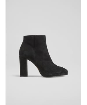 Embrace sophistication with the Sibella platform ankle boots. Made in Spain from luxurious black suede, these smart-casual boots feature a round toe, block heel, and leather lining, all in a textured design. Perfectly pair them with tailored trousers or a flowy dress for an effortlessly elegant look.