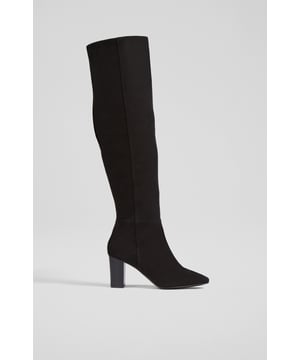 Timeless yet always impactful, our new Courtney over-the-knee boots are a winter investment you'll reach for season after season. Instantly dressing things up, they're crafted in Italy from classic black super-soft suede, and have an almond-shaped toe, a half inside zip and a black-stacked block heel. Wear them with your favourite dresses, mini skirts or over slim-fit jeans.