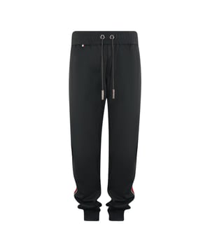 Philipp Plein Oddity Black Sweat Pants. These Philipp Plein black sweat pants are made for both style and comfort. Designed with a sleek black color and featuring a Taped Leg design, these sweatpants are perfect for any outfit. The perfect blend of fashion and functionality.. 100% Cotton, Drawstring Waistband, Oddity. Back Pocket, Leather Patch On Back Pocket. Made In Italy, Slim Fit, Elasticated Waistband And Leg Cuffs. Style Code: MRT0222 0213 Oddity