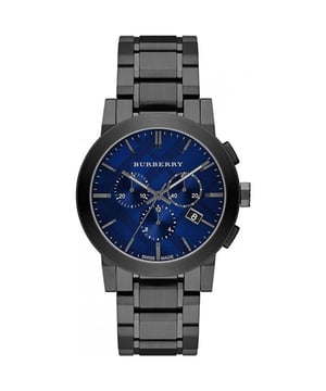 Presenting the Burberry Watch, model BU9365, a sophisticated union of function and fashion. This striking watch features a gunmetal stainless steel bracelet paired with a deep blue dial, embodying a bold, modern aesthetic. The dial is adorned with Burberry's London check pattern, accented with sleek, silver-tone hour markers and hands. Chronograph subdials and a date display enhance its utility. Swiss-made and powered by a quartz movement, this watch is a testament to precise craftsmanship. With water-resistant qualities, the BU9365 is designed for both style enthusiasts and the practically minded alike. Specification Details Brand Burberry Model BU9365 Barcode Number 822138047074 Gender Unisex Case Diameter 42 mm Case Material Stainless Steel Case Colour Gunmetal Dial Colour Blue with Check Pattern Band Material Stainless Steel Band Colour Gunmetal Movement Swiss Quartz Water Resistance 5 ATM Features Chronograph, Date Indicator