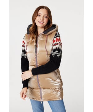 Add a puffer vest like this one to a transitional season wardrobe. With a hood, zip front closure, pockets with a zip detail and a longline fitted shape dropping to thigh length. Layer over your favourite knit pullover and jeans for a look that's perfect for when the weather turns colder.