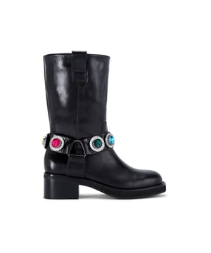 This Kurt Geiger Octavia Boot is crafted from a shiny black leather. There is a statement strap around the ankle featuring seven large multi-colour crystals surrounded by smaller ones. Heel height: 5cm.