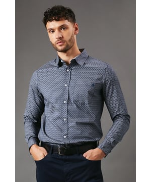 Eye-catching abstract shape print for a modern twist
        Long sleeves with buttoned cuffs for versatile wear
        Classic button-down collar adds a touch of refinement
        Chest pocket detail for added functionality
        Tailored fit flatters the silhouette
    
    Make a statement with this Maine abstract shape print long sleeve shirt. The unique pattern adds intrigue to your ensemble, perfect for those who appreciate distinctive style. Pair it with dark trousers and leather shoes for a smart-casual look that's ideal for family gatherings or relaxed office environments. For a more laid-back vibe, roll up the sleeves and team with your favourite jeans and trainers. The versatile design allows for easy transition from day to night - simply add a blazer for impromptu evening plans. This shirt is a testament to effortless style, offering both comfort and sophistication for the modern gent who values individuality in his wardrobe.