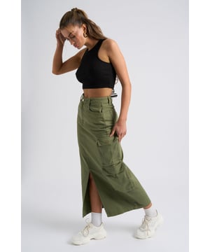 Model is 5'6 and wears a size S. Slim fit. High Waisted. Midi length. Introducing our Khaki Soda Cargo Skirt, a versatile and stylish addition to your wardrobe that effortlessly combines functionality with fashion-forward design. Crafted with attention to detail and quality, this skirt is perfect for those who seek comfort without compromising on style.