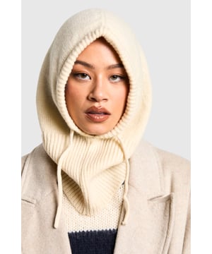 Cosy knitted balaclava-style hat
        Ribbed texture for added warmth
        Adjustable drawstring for a customised fit
        Extended neck coverage for extra protection
        Versatile design suitable for various winter activities
    
    Embrace the chilly weather with this snug and stylish balaclava-style hat from Boohoo. Perfect for those who crave both fashion and function, this piece offers comprehensive coverage from the crown of your head to your neck. The ribbed knit texture not only adds visual interest but also traps heat effectively, ensuring you stay toasty even on the coldest days. Style it with a chunky jumper and your favourite coat for a coordinated winter ensemble. Whether you're heading to a casual brunch with friends or embarking on a winter walk, this versatile hat adapts effortlessly to various occasions. Its neutral hue allows for easy pairing with your existing wardrobe, making it a must-have accessory for the fashion-forward woman who doesn't compromise on comfort.