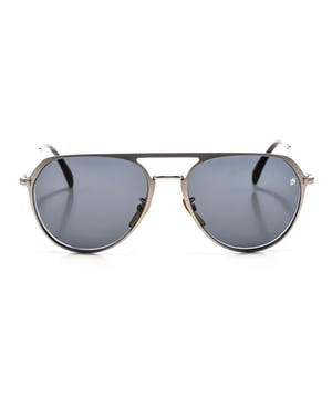 7095GS sunglasses with metal frame.

 Shape and design:
 - These David Beckham glasses have a round silhouette.

 Frame material:
 - The frame of these glasses is made of metal.
 - The use of metal provides durability and lightness to the frame.
 - This makes the glasses durable and comfortable to wear.

 Metal temples:
 - The temples are also made of metal, matching the frame material.
 - The metal on the temples adds solidity and stability to the structure of the glasses.

 Brand details:
 - David Beckham brand engraving on the lens.
 - These design elements help to clearly identify the model as part of the David Beckham eyewear collection.

 Glasses:
 - The lenses are of high quality.
 - These lenses provide excellent UV protection and sharp, clear vision.
 Measures: Lens height: 50 mm. Lens width: 58 mm. Bridge: 18 mm. Temples: 150 mm.
 Composition: Metal
 Care:
Use a soft, clean microfiber cloth to clean your sunglasses. This type of cloth will not scratch the lenses.
 Avoid using abrasive cleaning products, detergents, alcohol or acetone, as they can damage lenses and anti-reflective treatments.