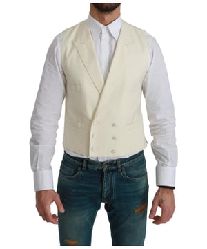 Brandneu mit Etikett  
100% Authentische Dolce & Gabbana Anzugweste  
Farbe: Creme off-white  
Modell: Formelle Anzugweste  
Material: 100% Schurwolle  
Drei Knopfverschluss vorne  
Logodetails  
Hergestellt in Italien