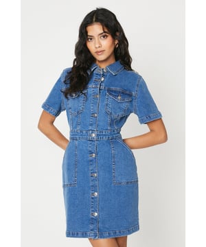 Petite denim mini dress with short sleeves
Button-through front with classic point collar
Fitted waist with belt loops
Two chest pockets with button-flap detail
cotton-rich denim fabric

This petite denim mini dress exudes casual chic. The short sleeves and mini length make it perfect for warm-weather days, while the button-through front and point collar lend a touch of refinement. The fitted waist with belt loops allows for a flattering, defined silhouette. Pair it with trainers and a denim jacket for a laidback brunch with friends, or dress it up with heeled sandals and statement jewellery for a casual evening out.